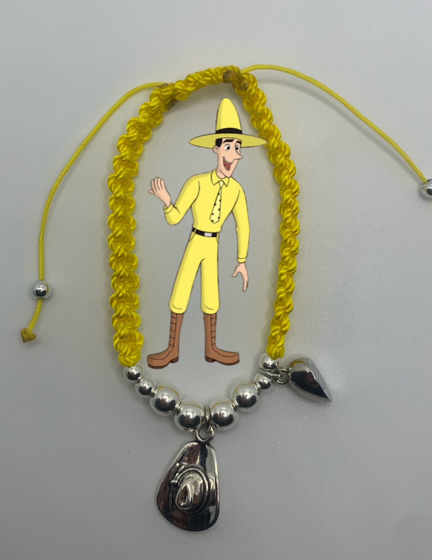 Curious/ man with the yellow hat